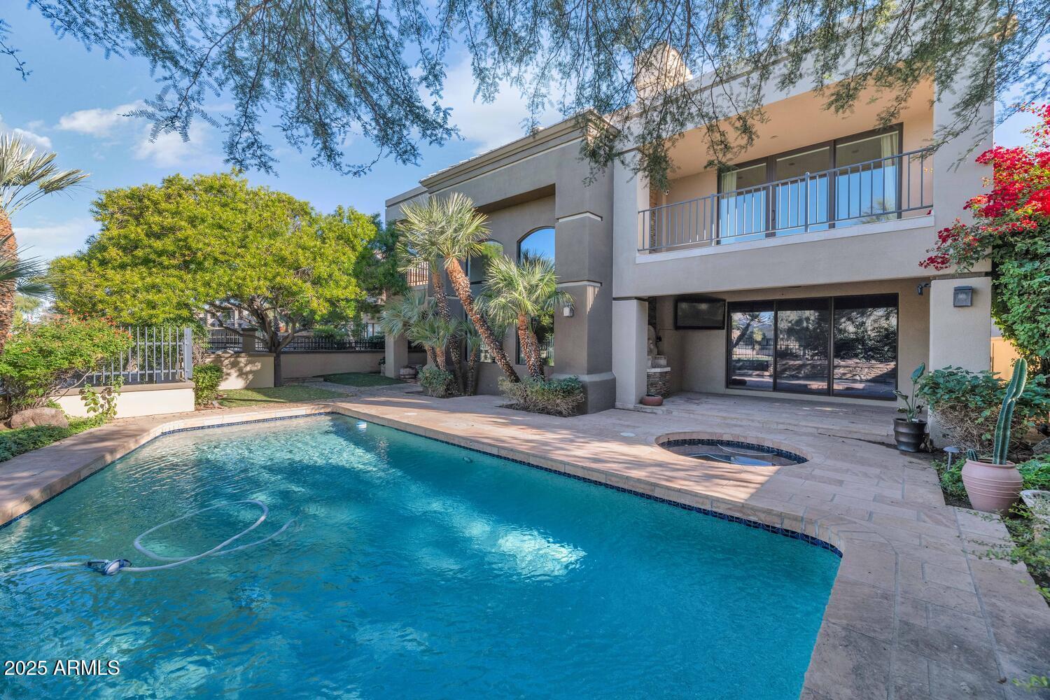 7878 East Gainey Ranch Road, Unit 25 Scottsdale, AZ 85258 - Photo 34 of 42 a front view of a house with garden