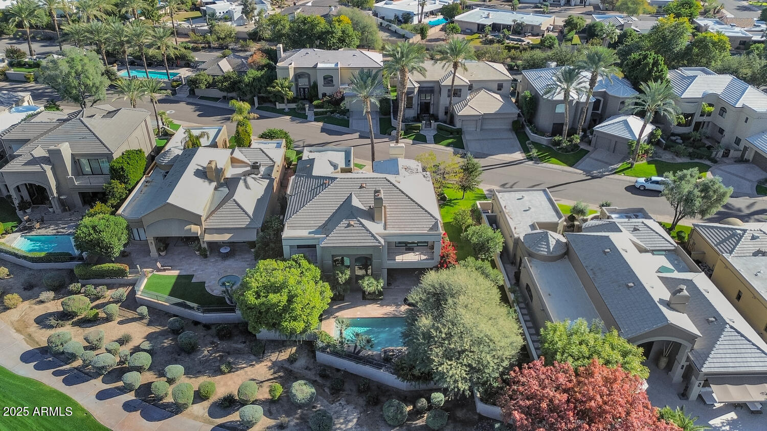 7878 East Gainey Ranch Road, Unit 25 Scottsdale, AZ 85258 - Photo 37 of 42 an aerial view of multiple houses with yard