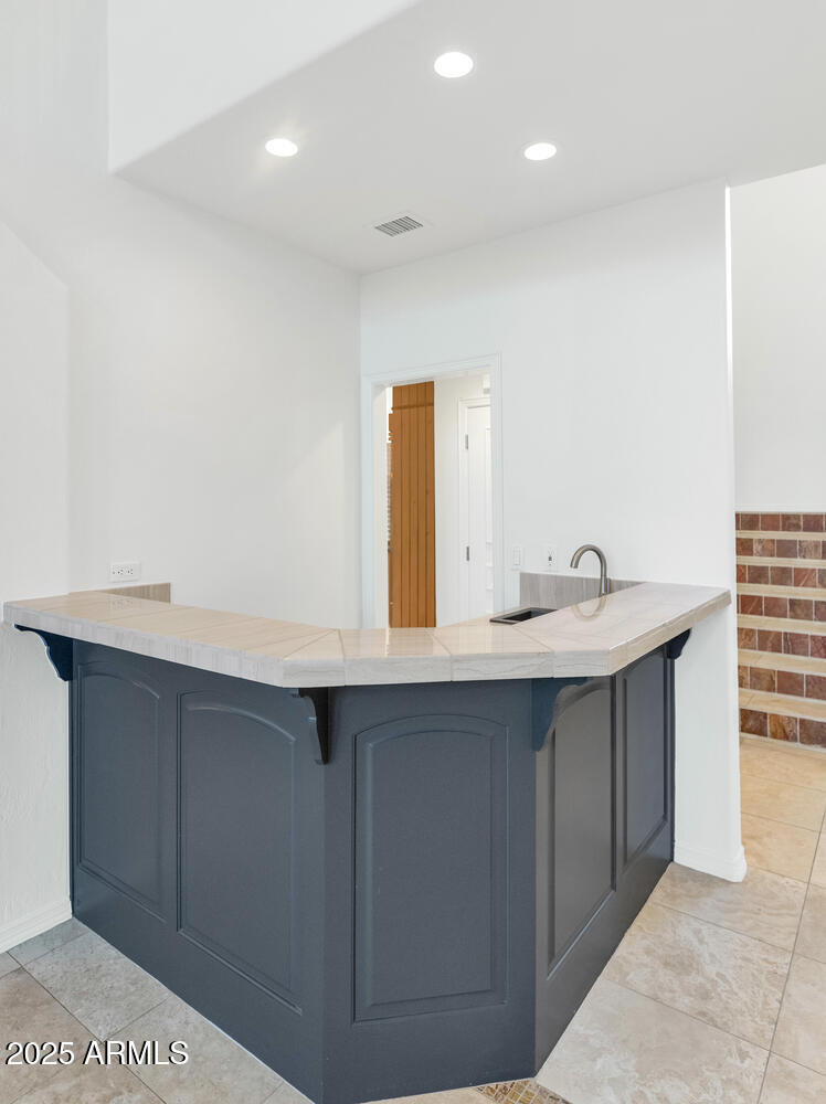 7878 East Gainey Ranch Road, Unit 25 Scottsdale, AZ 85258 - Photo 8 of 42 a bathroom with a sink and a mirror