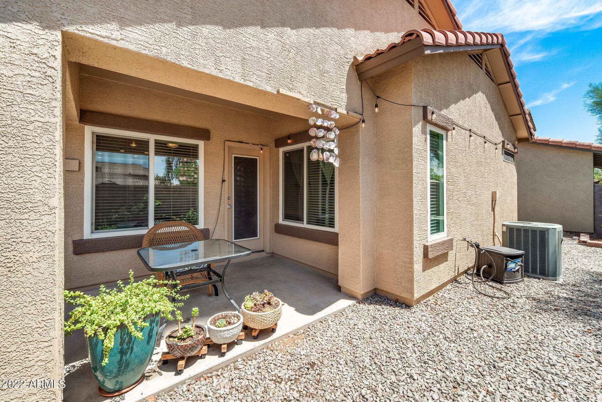 1868 South Rome Street Gilbert, AZ 85295 - Photo 29 of 34 a front view of a house with chairs