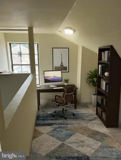 a workspace with furniture and window