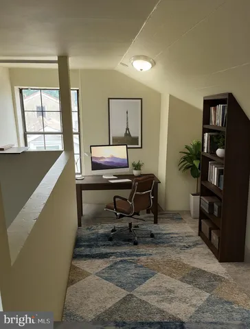a workspace with furniture and window