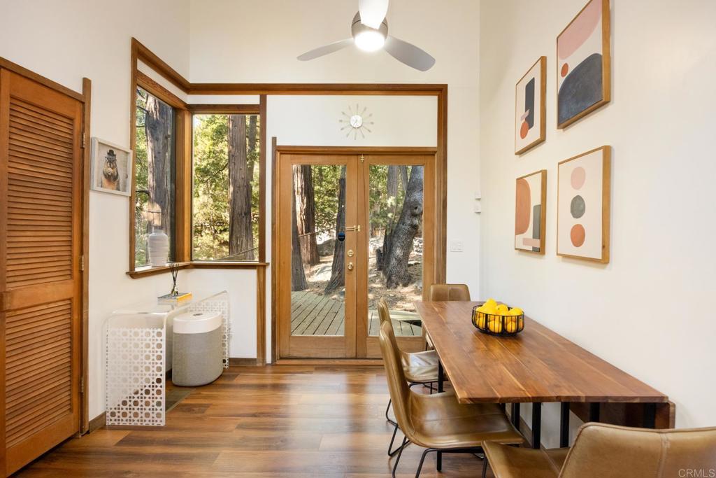 25650 Glen Road Idyllwild, CA 92549 - Photo 11 of 32 a view of a dining room with furniture and wooden floor