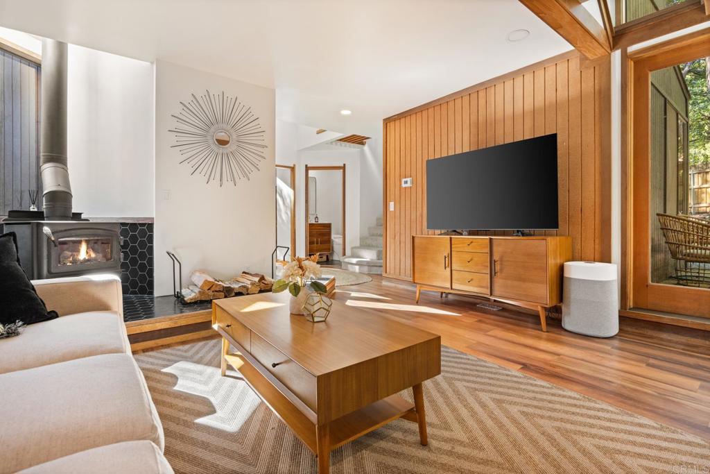 25650 Glen Road Idyllwild, CA 92549 - Photo 17 of 32 a living room with furniture and a flat screen tv