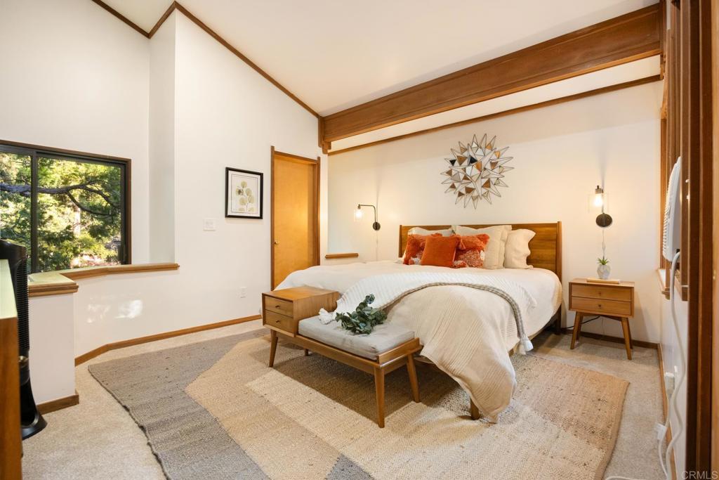 25650 Glen Road Idyllwild, CA 92549 - Photo 23 of 32 a bedroom with a bed and window