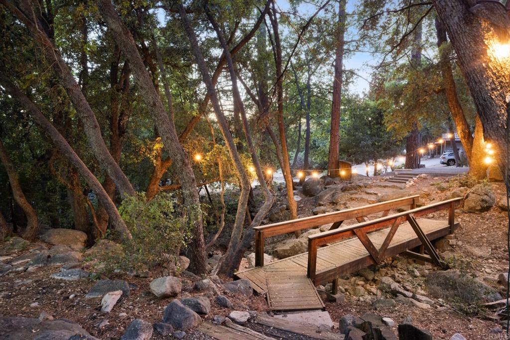 25650 Glen Road Idyllwild, CA 92549 - Photo 3 of 32 a view of a bench in a backyard