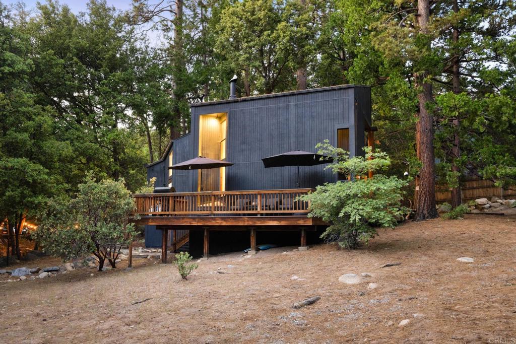 25650 Glen Road Idyllwild, CA 92549 - Photo 5 of 32 a backyard of a house with yard barbeque oven and outdoor seating