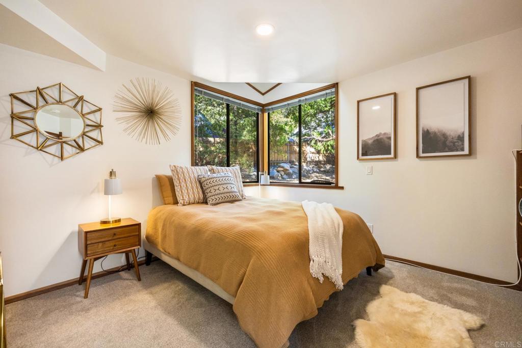 25650 Glen Road Idyllwild, CA 92549 - Photo 7 of 32 a bed sitting in a bedroom next to a window