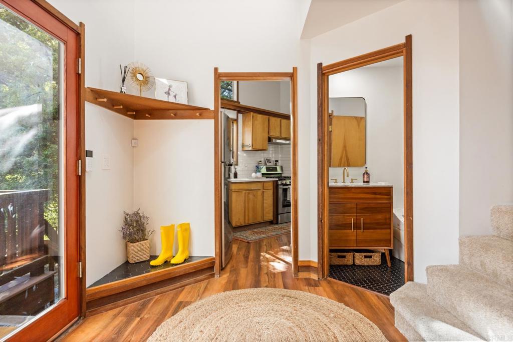 25650 Glen Road Idyllwild, CA 92549 - Photo 9 of 32 a bedroom with a bed and wooden floor