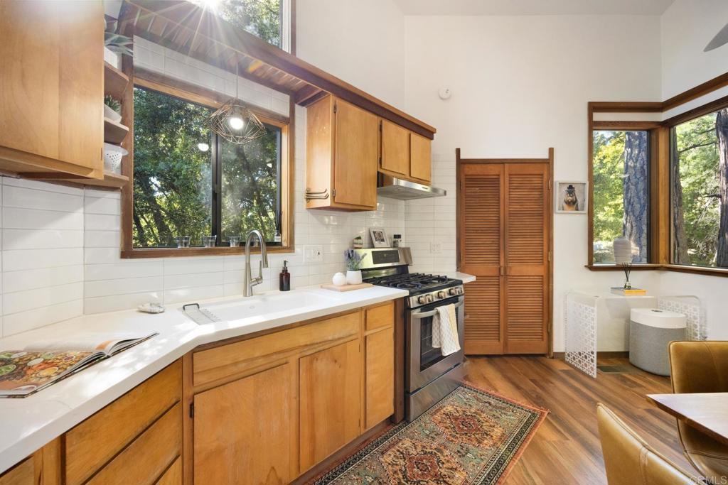 25650 Glen Road Idyllwild, CA 92549 - Photo 10 of 32 a kitchen with a sink stove and refrigerator