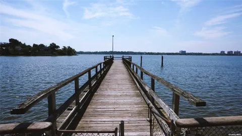 a view of wooden staircase with a lake view