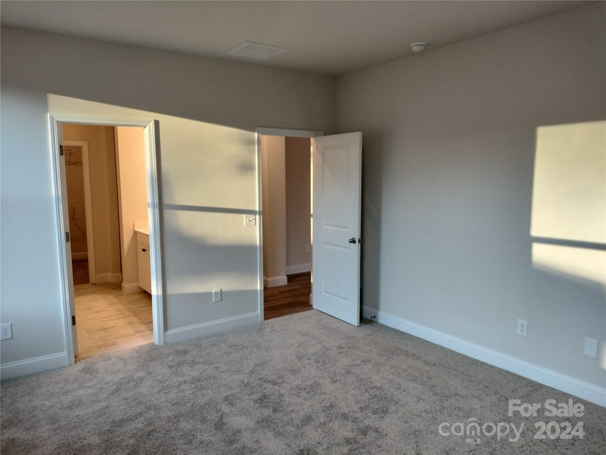 252 Hamrick Road, Unit 10 Cramerton, NC 28056 - Photo 16 of 37 an empty room with closet and a window