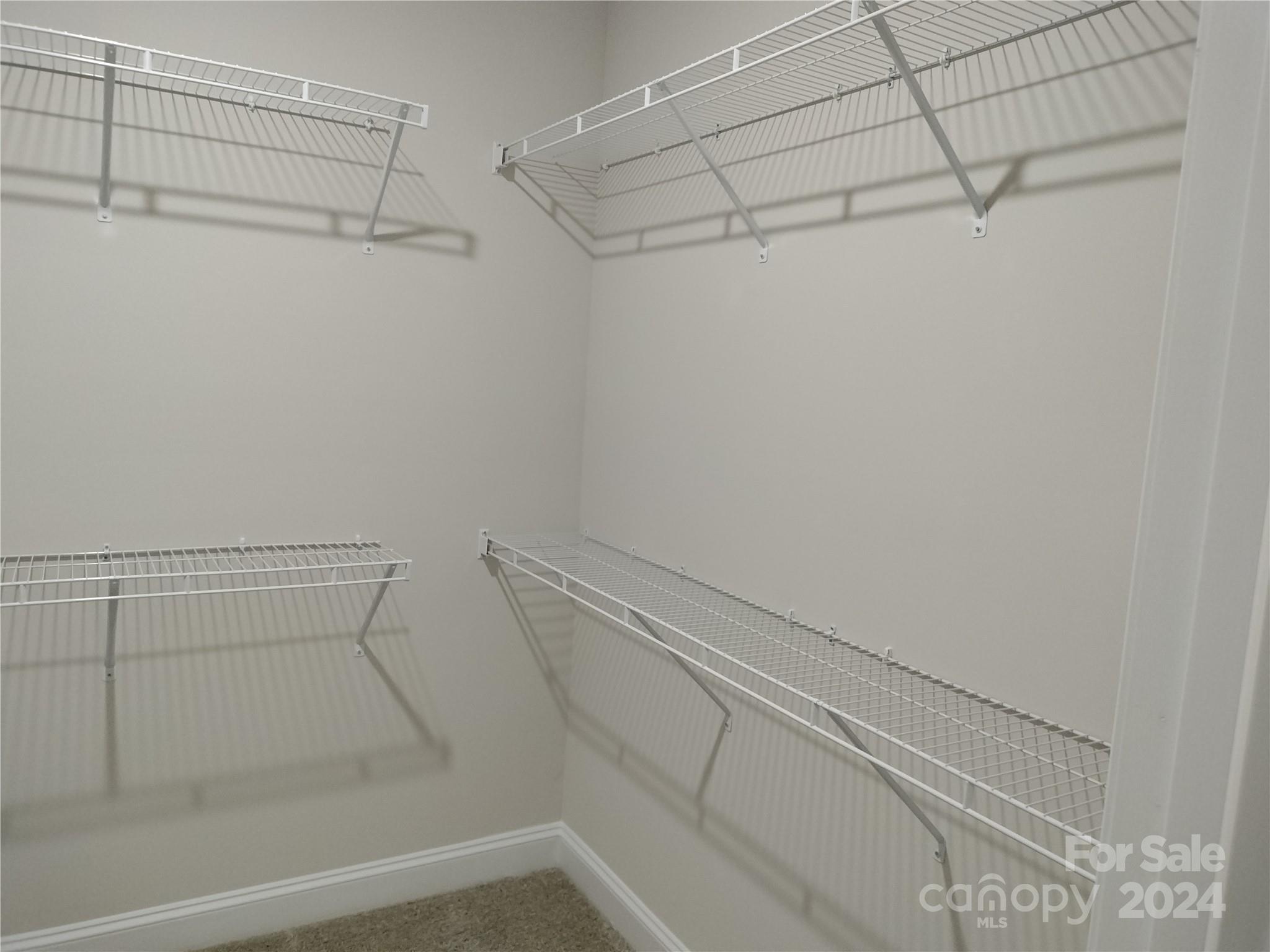 252 Hamrick Road, Unit 10 Cramerton, NC 28056 - Photo 18 of 37 a view of a room with racks on the wall