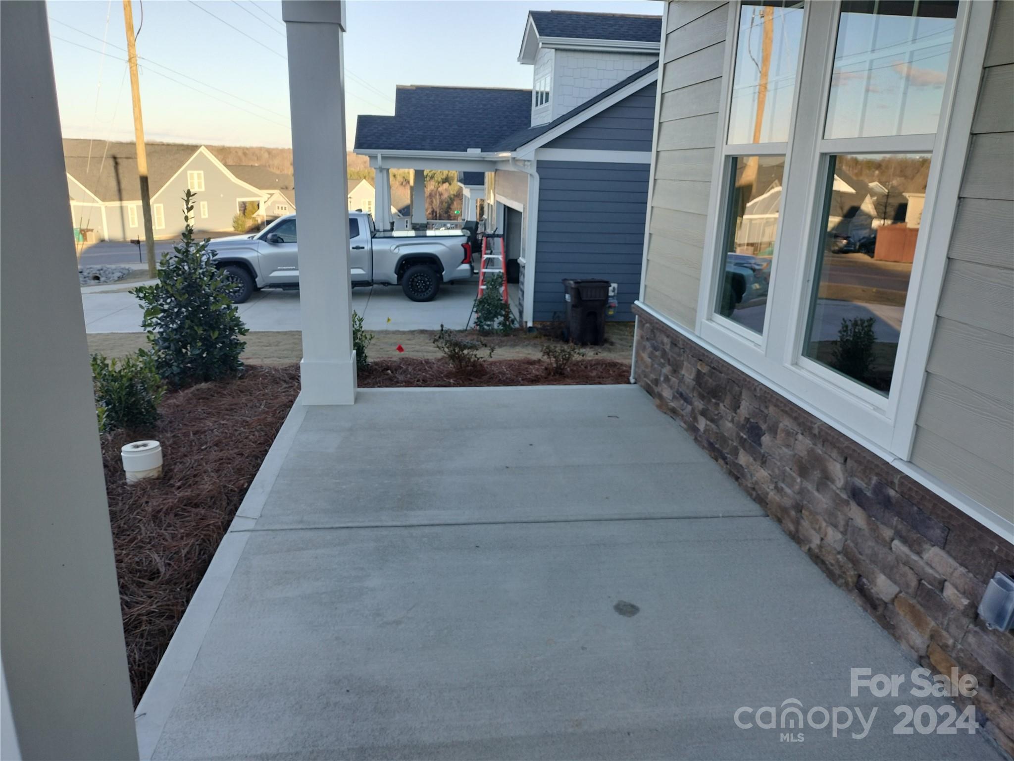 252 Hamrick Road, Unit 10 Cramerton, NC 28056 - Photo 2 of 37 a view of a porch with seating space
