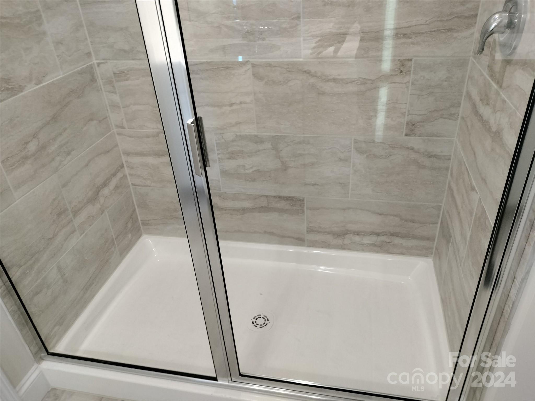 252 Hamrick Road, Unit 10 Cramerton, NC 28056 - Photo 21 of 37 a bathroom with a glass door shower