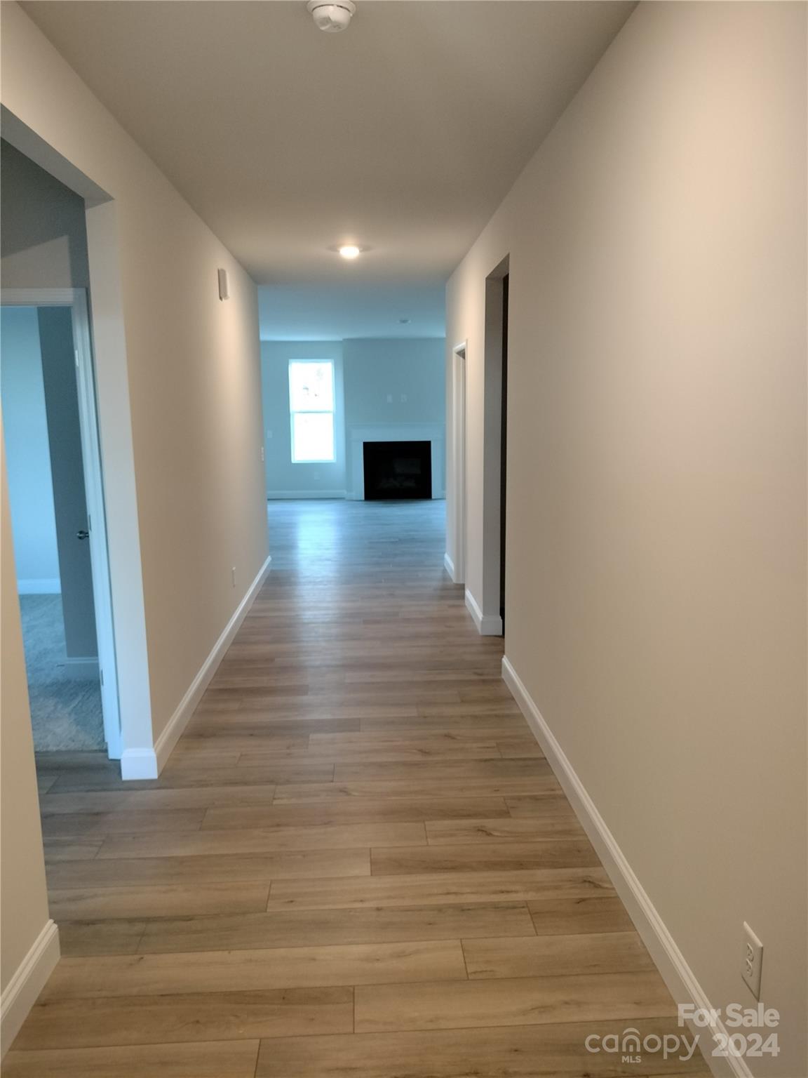 252 Hamrick Road, Unit 10 Cramerton, NC 28056 - Photo 5 of 37 a view of a hallway with wooden floor and staircase