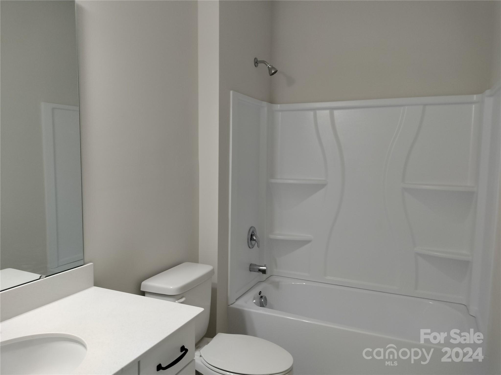 252 Hamrick Road, Unit 10 Cramerton, NC 28056 - Photo 8 of 37 a bathroom with a sink a toilet and bathtub