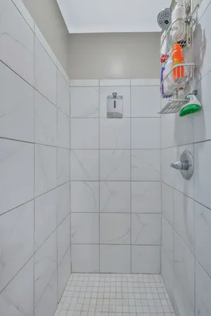a bathroom with a granite countertop sink a toilet and a mirror