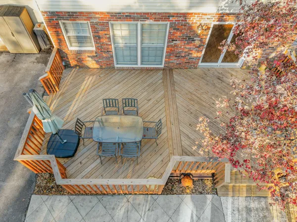 a view of a backyard with sitting area