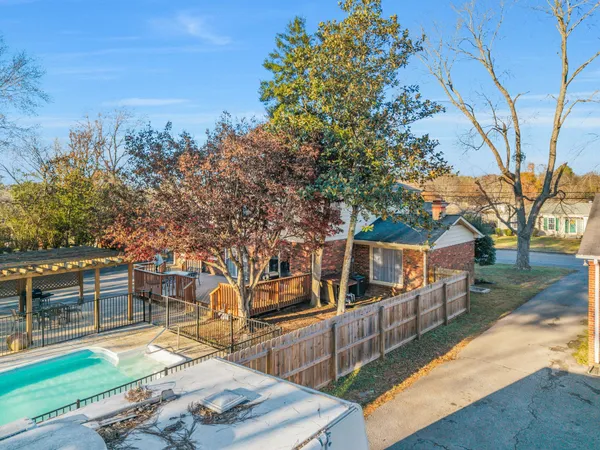 a view of a yard front of house