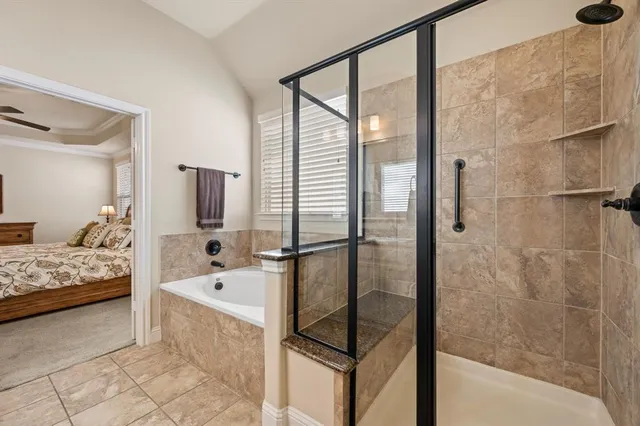 a bathroom with a tub and a shower