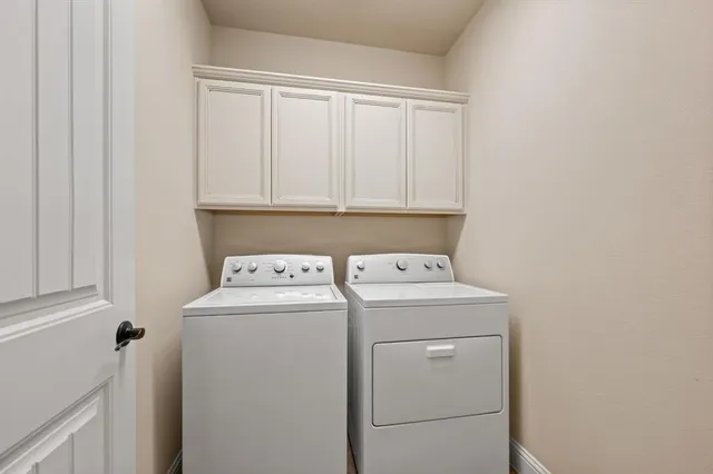 a view of a livingroom with wooden floor and furniture