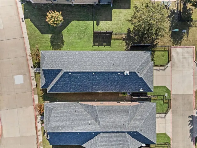 a view of multiple houses with a street