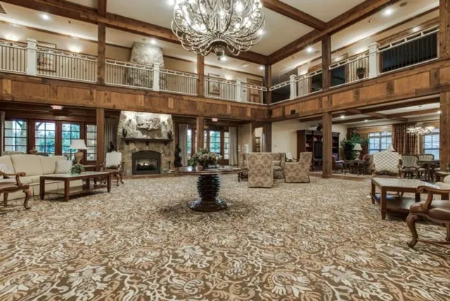 a view of a room with lots of wooden furniture