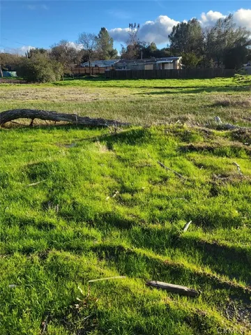 a view of a golf course with a lake view