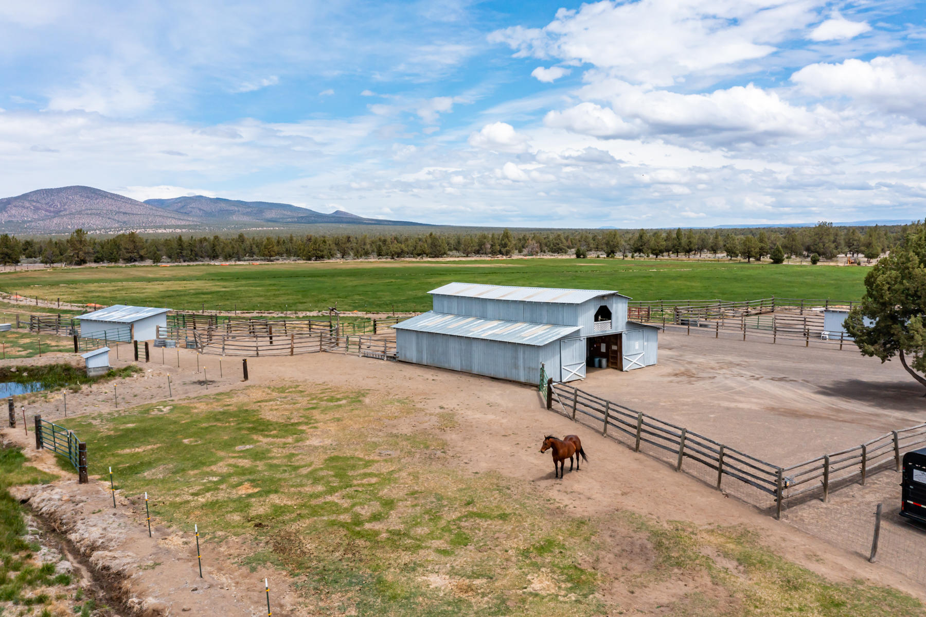 63520 Johnson Ranch Road Bend, OR 97701 - Photo 50 of 52 Barn & Hay Field