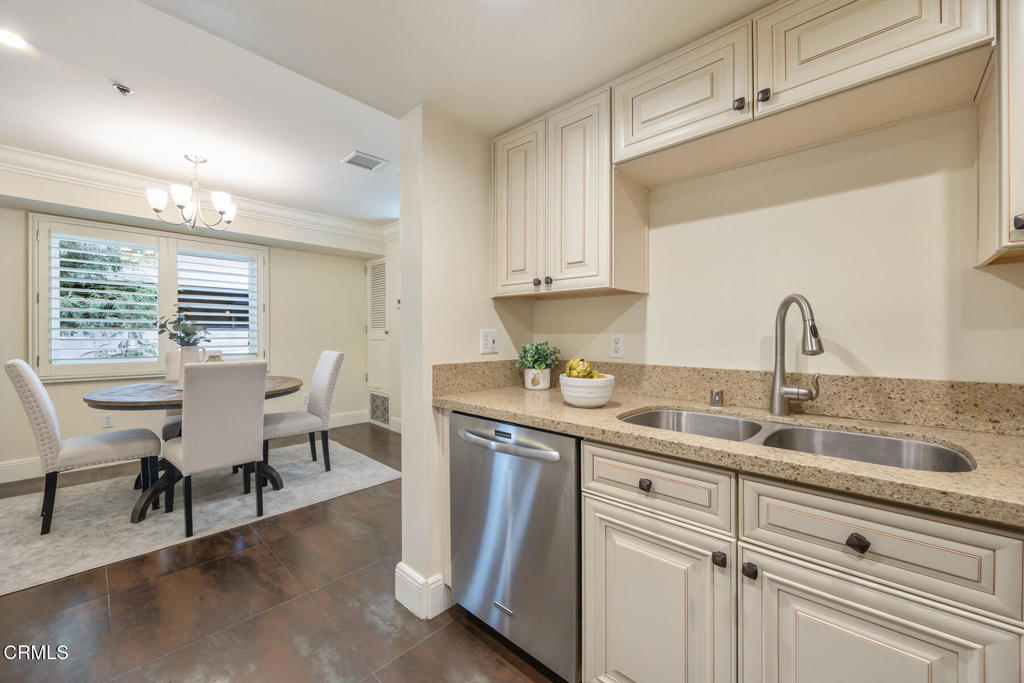 120 South Mentor Avenue, Unit 202 Pasadena, CA 91106 - Photo 11 of 40 a kitchen with cabinets and outdoor view