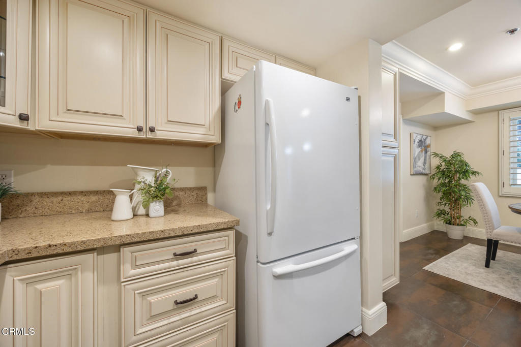 120 South Mentor Avenue, Unit 202 Pasadena, CA 91106 - Photo 12 of 40 a white refrigerator freezer sitting inside of a kitchen