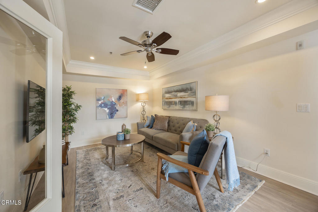 120 South Mentor Avenue, Unit 202 Pasadena, CA 91106 - Photo 13 of 40 a living room with furniture and a flat screen tv