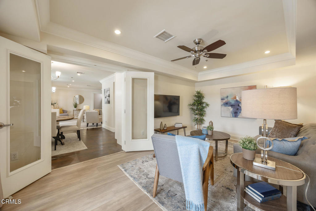120 South Mentor Avenue, Unit 202 Pasadena, CA 91106 - Photo 14 of 40 a living room with furniture a flat screen tv and a table