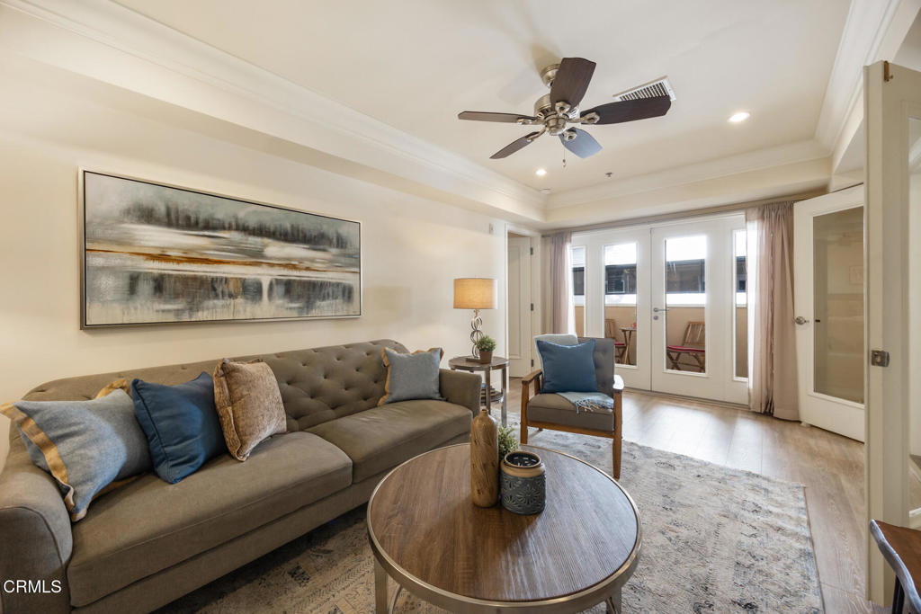 120 South Mentor Avenue, Unit 202 Pasadena, CA 91106 - Photo 15 of 40 a living room with furniture and a large window