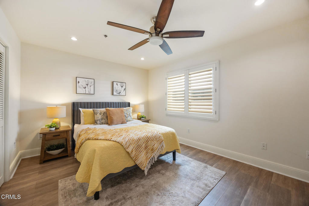 120 South Mentor Avenue, Unit 202 Pasadena, CA 91106 - Photo 19 of 40 a bedroom with a bed and window