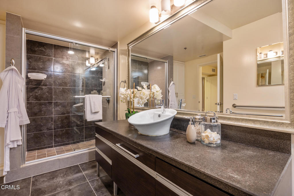 120 South Mentor Avenue, Unit 202 Pasadena, CA 91106 - Photo 21 of 40 a kitchen with a sink and a mirror