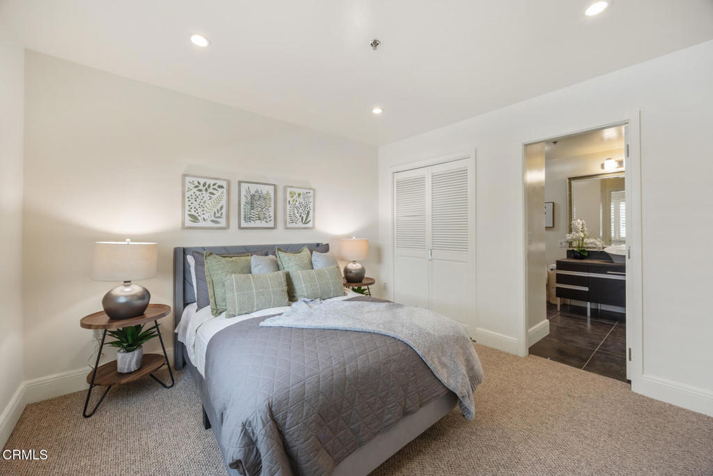 120 South Mentor Avenue, Unit 202 Pasadena, CA 91106 - Photo 29 of 40 a bedroom with a bed and a cabinets