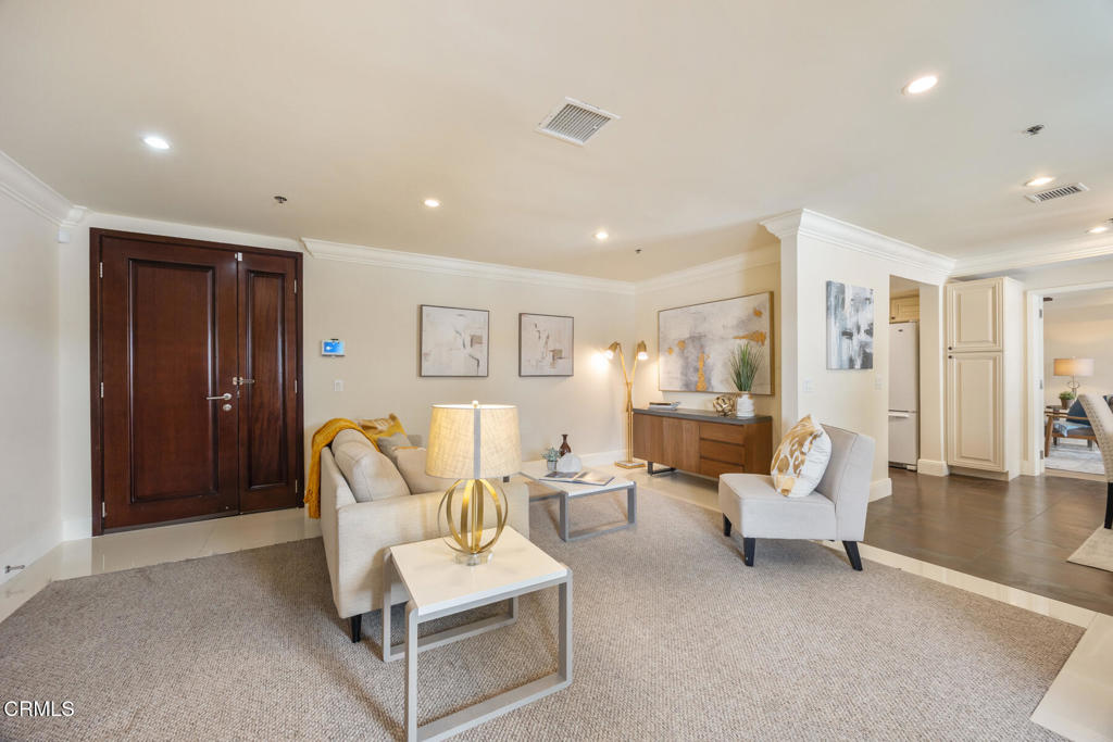 120 South Mentor Avenue, Unit 202 Pasadena, CA 91106 - Photo 3 of 40 a living room with furniture and wooden floor