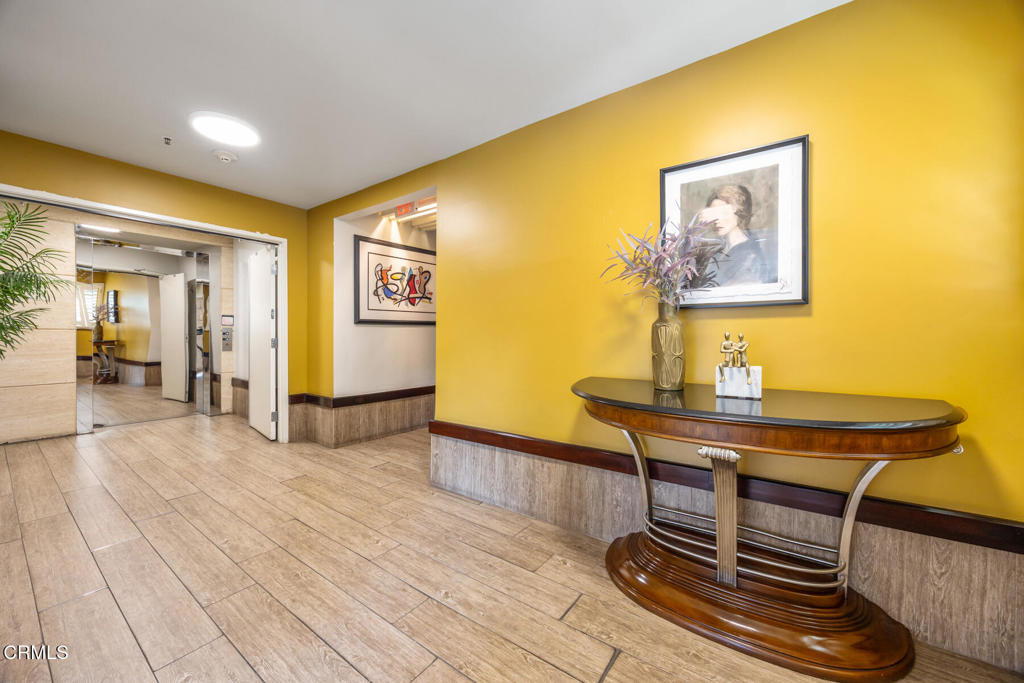 120 South Mentor Avenue, Unit 202 Pasadena, CA 91106 - Photo 37 of 40 a view of a livingroom with furniture and wooden floor
