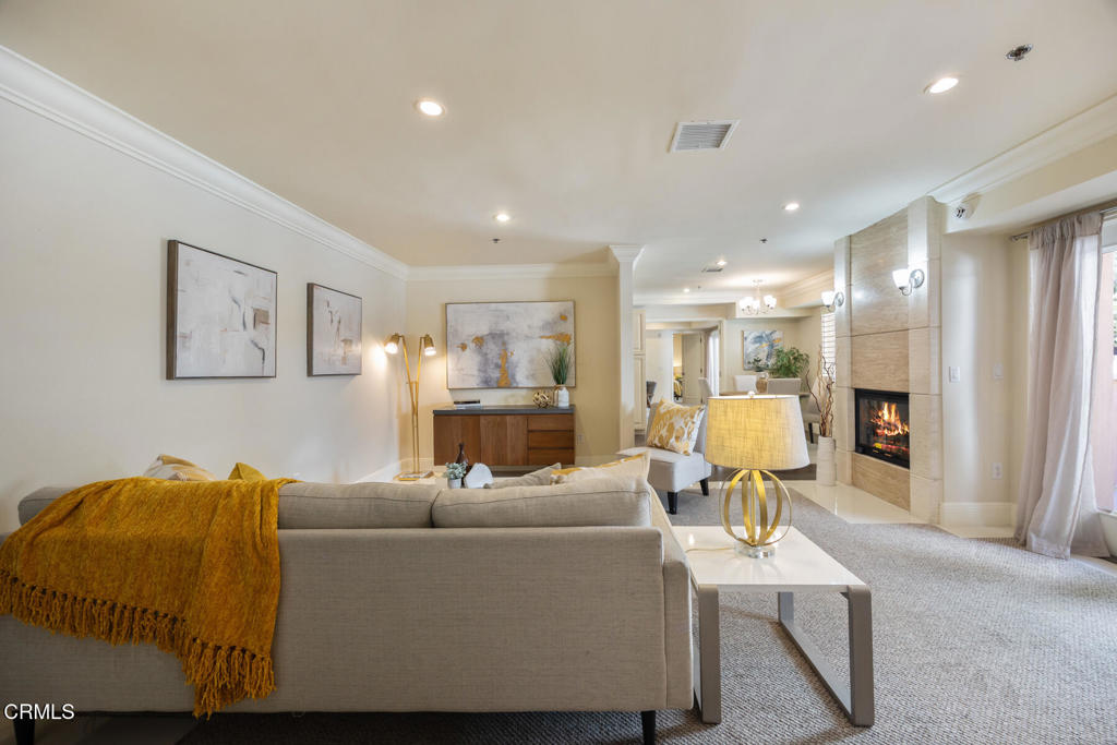 120 South Mentor Avenue, Unit 202 Pasadena, CA 91106 - Photo 5 of 40 a living room with furniture and a table