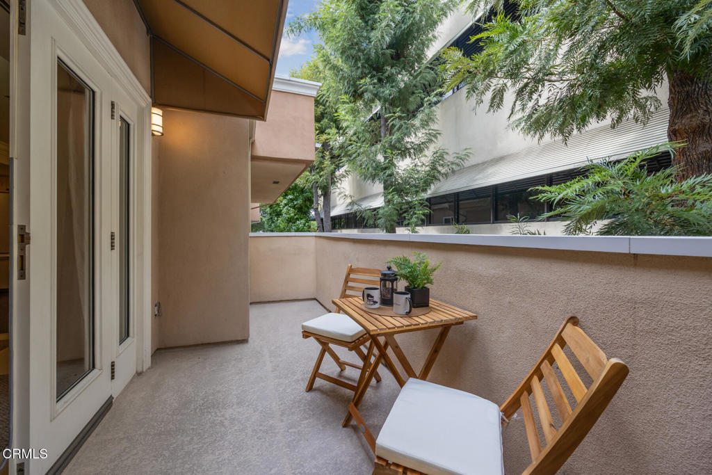 120 South Mentor Avenue, Unit 202 Pasadena, CA 91106 - Photo 7 of 40 a backyard of a house with table and chairs