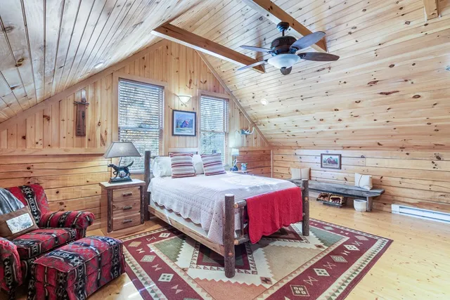 a bed room with a bed and a clock