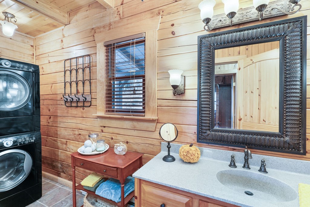 488 Smith Road Brasstown, NC 28902 - Photo 16 of 42 a bathroom with a sink and a mirror
