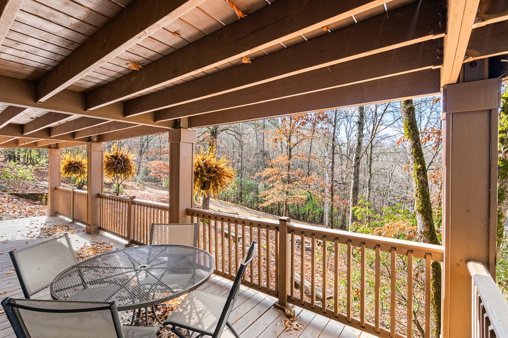 488 Smith Road Brasstown, NC 28902 - Photo 26 of 42 a view of a porch with furniture and a yard