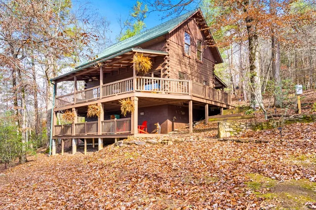 a balcony with a table and chairs