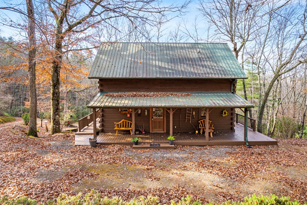 488 Smith Road Brasstown, NC 28902 - Photo 30 of 42 a view of a chairs and table in the backyard