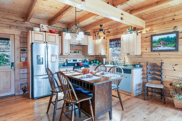 a view of a dining area with furniture window and wooden floor