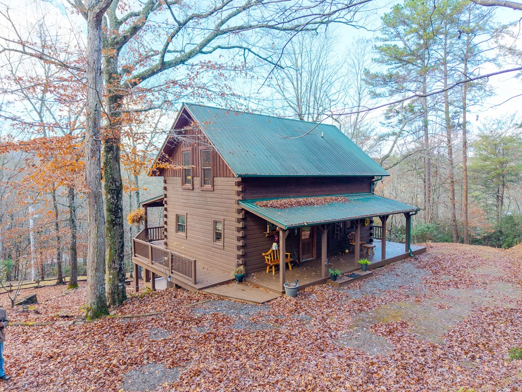 488 Smith Road Brasstown, NC 28902 - Photo 40 of 42 a view of a house with a yard and sitting area