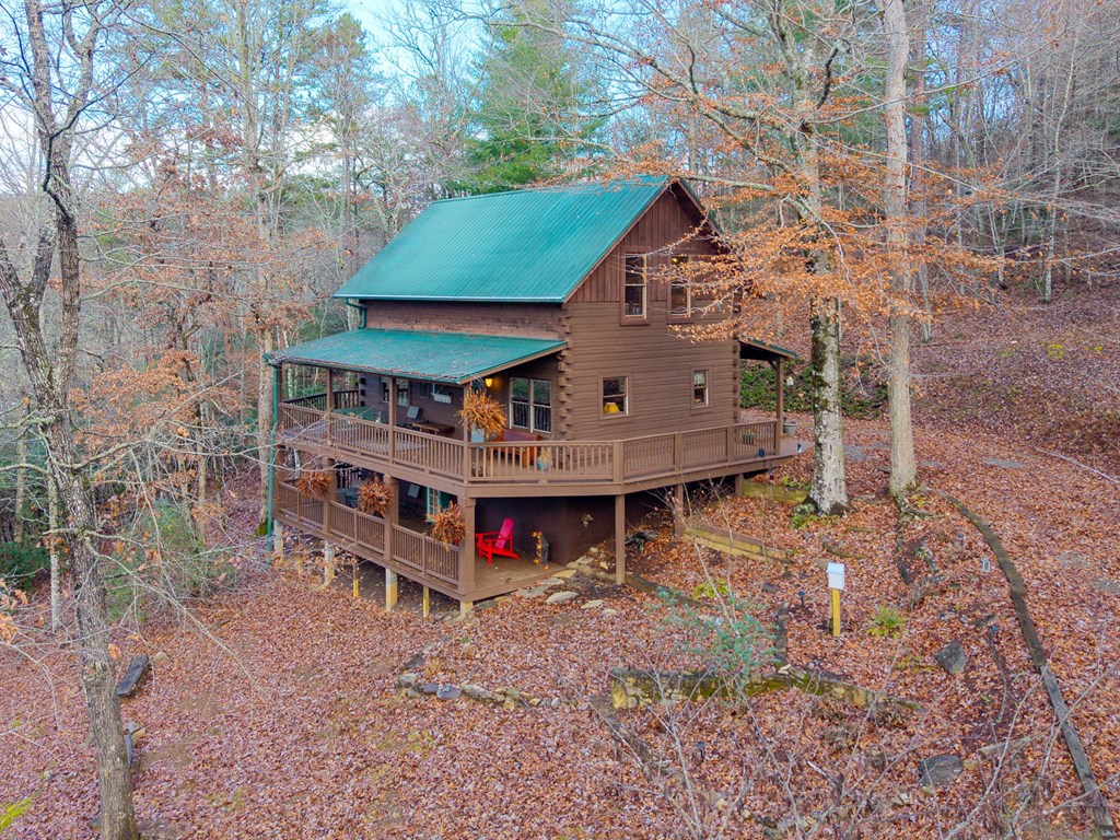 488 Smith Road Brasstown, NC 28902 - Photo 41 of 42 a view of a house with a yard and sitting area